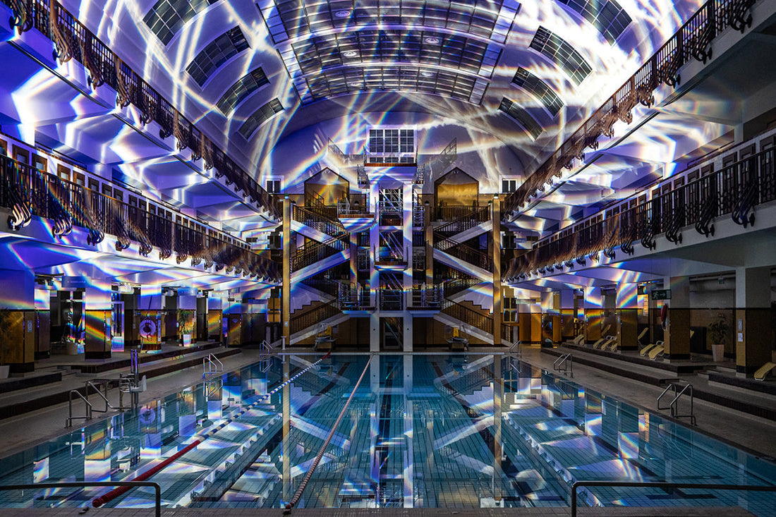 The Amalienbad swimming pool building in Vienna illuminated with coloured light from Permacolor dichroic filters